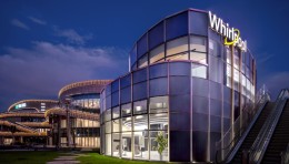 宁波惠而浦展厅设计赏析：从绞纽式洗衣机到金属挂片的工业美学演变